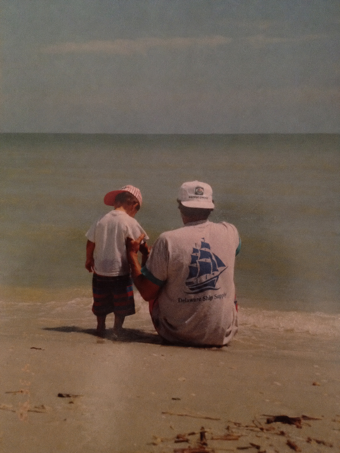 Will Rush as a child on the beach with his father, Don Rush of Delaware Ship Supply
